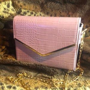 Pink snake skin clutch with gold chain